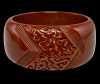 BB235 wide chocolate brown curlicue carved bakelite bangle